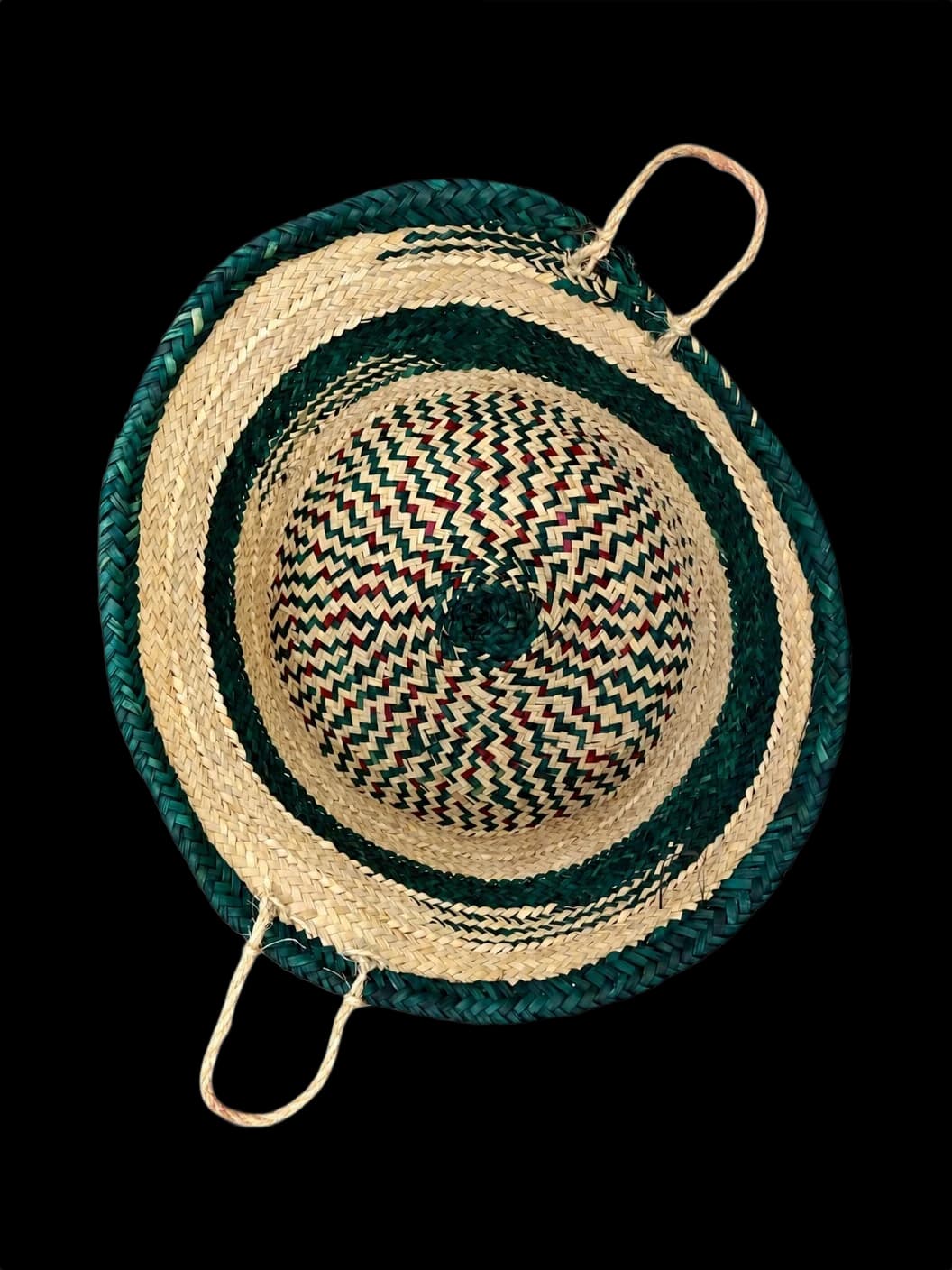 Palm-leaf basket with green stripes and rope handles — top view