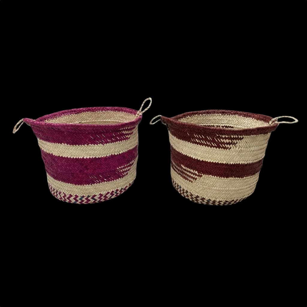 Two palm-leaf baskets with fuchsia and maroon stripes